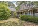 The side exterior shows a well-landscaped yard and a partial view of the home's architectural style at 143 Cotton Mill Dr, Hiram, GA 30141