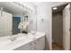 Bright bathroom featuring a double vanity, decorative orchid, and a separate shower room at 6695 Buckingham Cir, Cumming, GA 30040