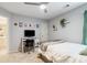 Bedroom featuring plush carpets, desk, ceiling fan, and cozy gray walls at 6695 Buckingham Cir, Cumming, GA 30040