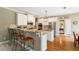 Stylish kitchen with granite countertops, stainless steel appliances, and white cabinetry at 6695 Buckingham Cir, Cumming, GA 30040