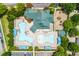 Aerial view of community pool and recreation center with amenities,parking and greenspace at 9967 Devonshire St, Douglasville, GA 30135