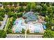Aerial view of community pool and recreation center with lush landscaping and amenities at 9967 Devonshire St, Douglasville, GA 30135