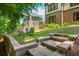 Beautiful backyard with a stone patio and green lawn at 9967 Devonshire St, Douglasville, GA 30135