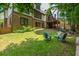 Spacious backyard with a brick and siding exterior and a well-maintained lawn at 9967 Devonshire St, Douglasville, GA 30135