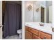 Bathroom featuring a single vanity and shower/tub with gray shower curtain at 9967 Devonshire St, Douglasville, GA 30135