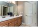 Bathroom featuring a double vanity, white countertops and tile flooring at 9967 Devonshire St, Douglasville, GA 30135