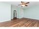 Spacious bedroom with hardwood floors, ceiling fan, and ample natural light at 9967 Devonshire St, Douglasville, GA 30135