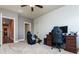 Bedroom with carpeted floors currently in use as an office or gaming room with natural lighting at 9967 Devonshire St, Douglasville, GA 30135