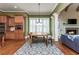 Inviting dining area with hardwood floors, abundant natural light, and access to the kitchen and living room at 9967 Devonshire St, Douglasville, GA 30135