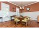 Cozy dining room showcasing hardwood floors, elegant lighting, and detailed trim at 9967 Devonshire St, Douglasville, GA 30135
