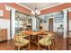 Open-concept dining room next to living room with hardwood floors at 9967 Devonshire St, Douglasville, GA 30135