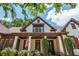 Stunning exterior with a charming front porch and well-manicured landscaping at 9967 Devonshire St, Douglasville, GA 30135