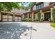 Inviting exterior with a spacious driveway and a two-car garage with a covered front porch at 9967 Devonshire St, Douglasville, GA 30135