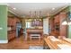 Spacious kitchen featuring stainless steel appliances, eat-in table and wood cabinets at 9967 Devonshire St, Douglasville, GA 30135