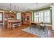 Open kitchen and breakfast area with stainless appliances and wooden cabinets at 9967 Devonshire St, Douglasville, GA 30135