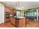 Open concept kitchen with stainless steel appliances, granite counters and adjoining living room at 9967 Devonshire St, Douglasville, GA 30135