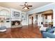 Comfortable living room featuring a fireplace, built-in shelving, and an open floor plan at 9967 Devonshire St, Douglasville, GA 30135
