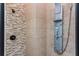 Modern shower with multi-spray system and attractive horizontal tiled accent wall at 9967 Devonshire St, Douglasville, GA 30135