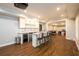 Finished basement features a granite topped bar with modern appliances and stylish accents at 1105 River Laurel Dr, Suwanee, GA 30024