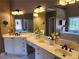 Bathroom featuring double sinks and decorative flowers at 1105 River Laurel Dr, Suwanee, GA 30024