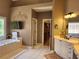 Luxurious bathroom featuring a soaking tub, walk-in closet, and a double vanity at 1105 River Laurel Dr, Suwanee, GA 30024
