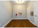 Bonus Room offers versatility with a large pegboard wall and durable wood flooring at 1105 River Laurel Dr, Suwanee, GA 30024