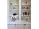 Close-up of a built-in bookcase with decorative items on display at 1105 River Laurel Dr, Suwanee, GA 30024