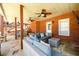 Enjoy outdoor living on this covered patio with stone flooring, ceiling fans, and comfortable seating at 1105 River Laurel Dr, Suwanee, GA 30024