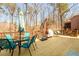 Charming deck with outdoor dining set, grill, and comfortable seating, ideal for entertaining and enjoying the natural setting at 1105 River Laurel Dr, Suwanee, GA 30024