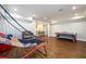 Bright game room with wood floors and open design, perfect for entertainment and leisure at 1105 River Laurel Dr, Suwanee, GA 30024