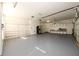 Large garage with painted floor and built in shelves for maximum storage and organization at 1105 River Laurel Dr, Suwanee, GA 30024