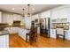 Modern kitchen with granite countertops, stainless steel appliances, and a central island perfect for entertaining at 1105 River Laurel Dr, Suwanee, GA 30024