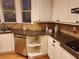 Kitchen area with stainless steel appliances, granite countertops, and neutral backsplash at 1105 River Laurel Dr, Suwanee, GA 30024
