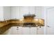 Well-equipped kitchen features granite countertops, diamond backsplash, and white cabinets creating a clean design at 1105 River Laurel Dr, Suwanee, GA 30024