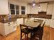 Updated kitchen with granite countertops, stainless steel appliances, and an island with seating at 1105 River Laurel Dr, Suwanee, GA 30024