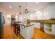 Spacious kitchen with granite countertops, stainless steel appliances, and connected dining area in a bright open space at 1105 River Laurel Dr, Suwanee, GA 30024