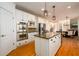 Kitchen with stainless steel appliances, granite countertops, central island, and view into the breakfast area at 1105 River Laurel Dr, Suwanee, GA 30024