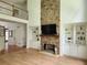 Bright living room with fireplace and built-in shelves at 1105 River Laurel Dr, Suwanee, GA 30024