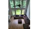 High-ceilinged living room featuring natural lighting and a large seating area at 1105 River Laurel Dr, Suwanee, GA 30024
