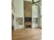 Spacious living room features a stone fireplace and built-in bookcases at 1105 River Laurel Dr, Suwanee, GA 30024