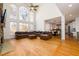 Bright, open living room with high ceilings, hardwood floors, and a large window wall offering scenic views at 1105 River Laurel Dr, Suwanee, GA 30024
