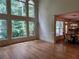 Bright open-concept space features hardwood floors and large windows at 1105 River Laurel Dr, Suwanee, GA 30024