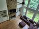 High angle of beautiful living room featuring natural lighting and a stacked stone fireplace at 1105 River Laurel Dr, Suwanee, GA 30024