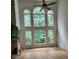 Living room showcases soaring windows providing scenic view and natural light at 1105 River Laurel Dr, Suwanee, GA 30024
