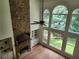 Living area features a stone fireplace, built-in shelves, and oversized windows at 1105 River Laurel Dr, Suwanee, GA 30024