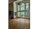 Bright living room with stone fireplace, built-in cabinets, and soaring windows at 1105 River Laurel Dr, Suwanee, GA 30024