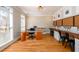 Home office with desk, storage, and natural light from large windows. Ideal for work and projects at 1105 River Laurel Dr, Suwanee, GA 30024