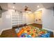 Bright basement play area with built in bookshelves and a colorful, educational map rug at 1105 River Laurel Dr, Suwanee, GA 30024