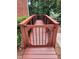 Wood ramp with black railings for safe garden and yard access at 1105 River Laurel Dr, Suwanee, GA 30024