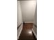 Carpeted staircase leading to an upstairs level with hardwood floors at 1105 River Laurel Dr, Suwanee, GA 30024